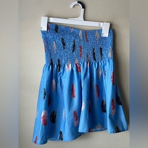 Blue tube top with feathers on it.